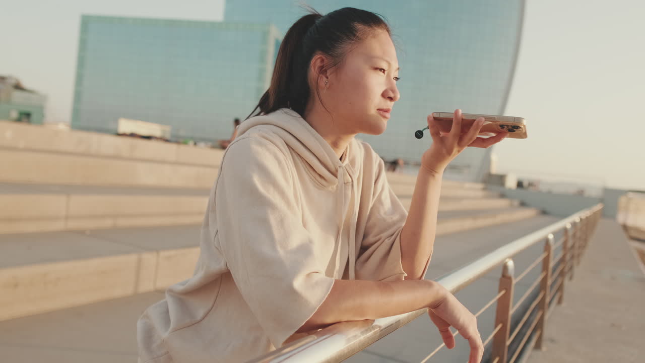 Woman talking on phone in an urban setting