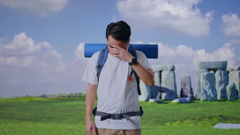 stressed traveler at stonehenge