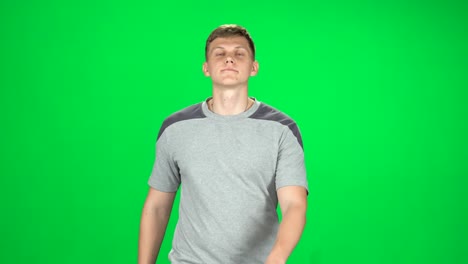 man in gray shirt on green screen