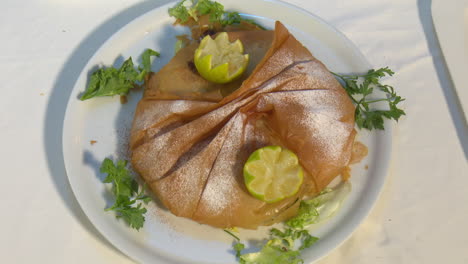 moroccan pastry dish with lemon and herbs