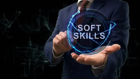 businessman shows concept hologram soft skills