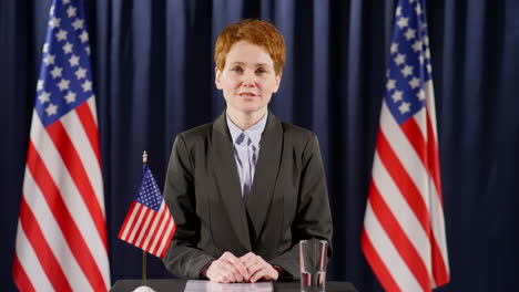 female politician speaking on camera at press conference