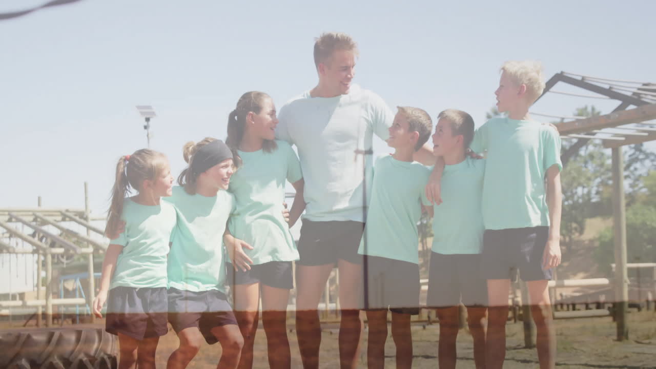 At outdoor playground, children and adult in sportswear making animation activities