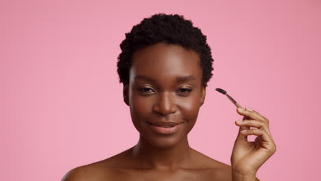 woman applying brow makeup