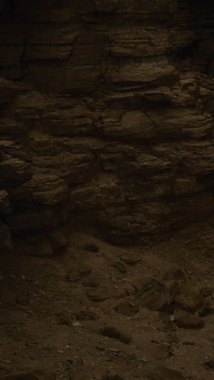 Rock formations and sandy ground at hiking location in a warm landscape