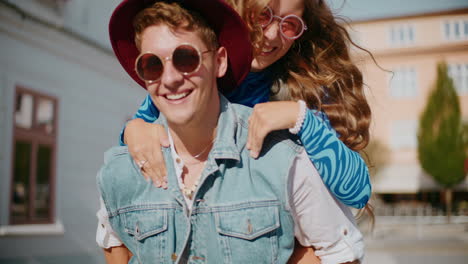 couple enjoying a piggyback ride in the city
