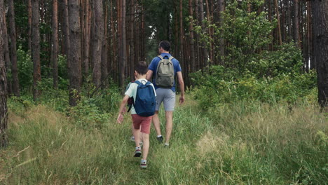 man and children at the forest