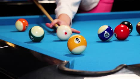 playing a game of pool billiards missing the half yellow ball not hitting it in