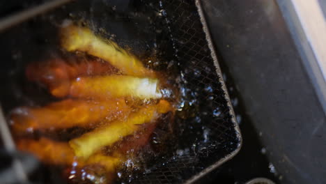 golden fries sizzling in the fryer