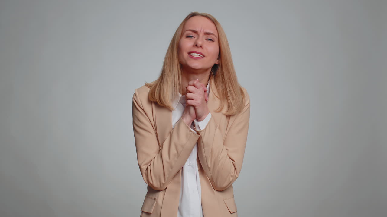 Business office woman praying looking upward making wish begging apology asking help forgive me