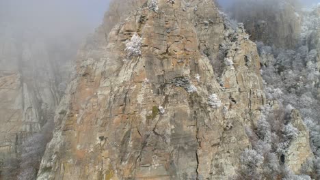 snowy mountain cliff face