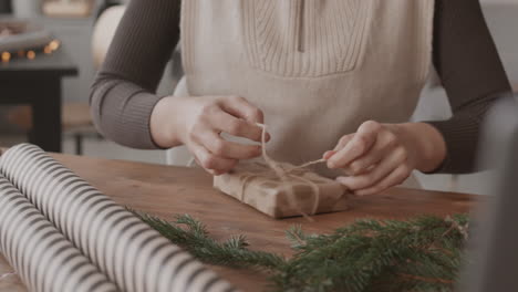 tying twine on christmas gift