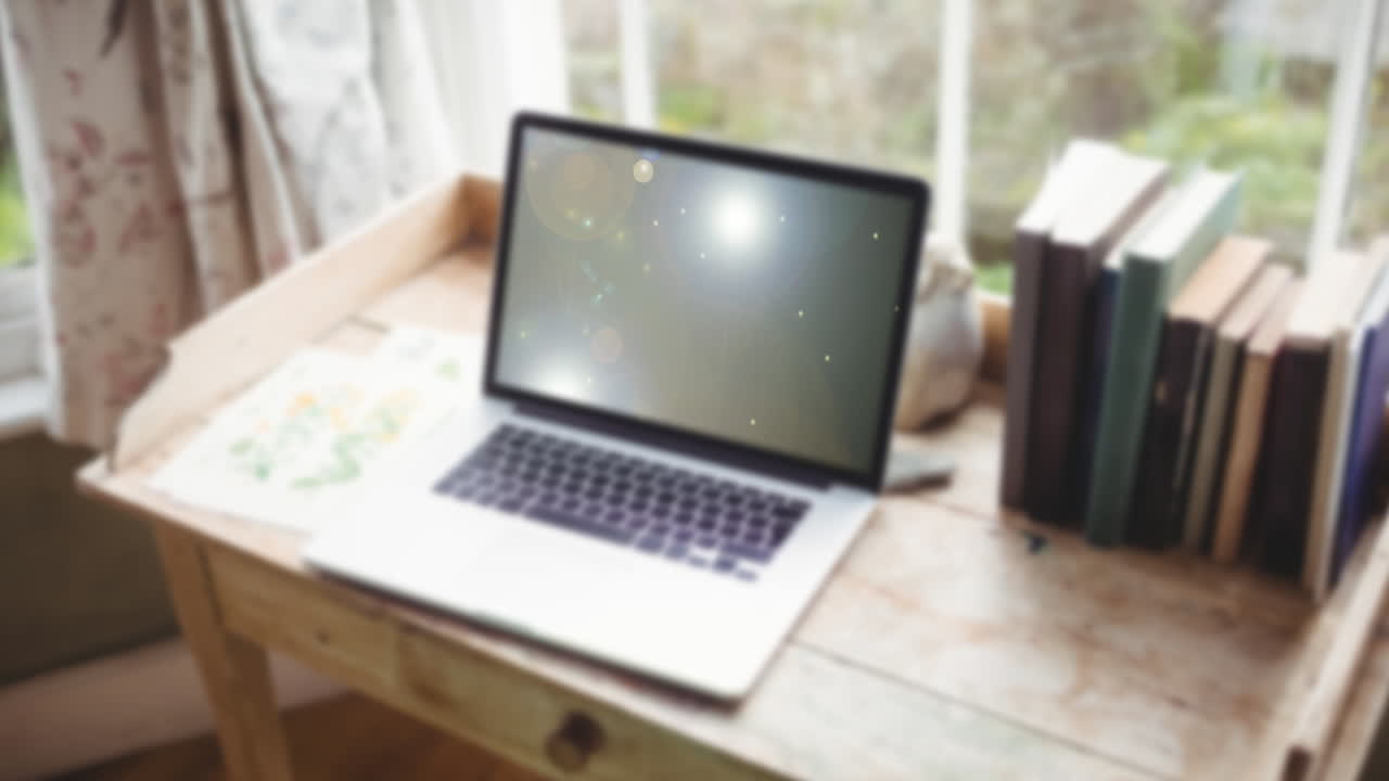 노트북 위의 빛 점의 애니메이션