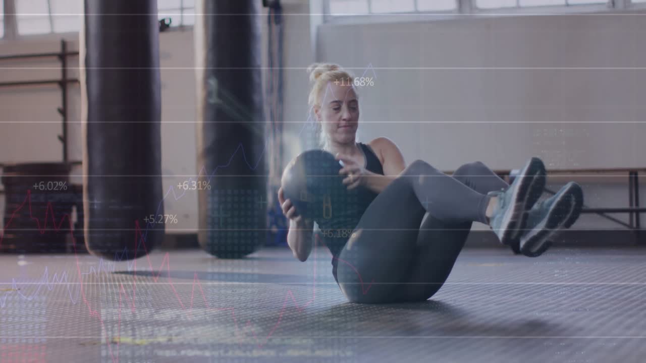 Fitness enthusiast holding medicine ball initiating torso twisting on mat, boosting core stability