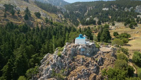 fly over rocky mountain with the monastery of agios ioannis in kos, dodecanese island, greece