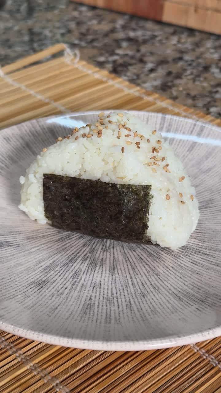 Onigiri Made Of Rice And Nori Seaweed - Close Up, Vertical Shot