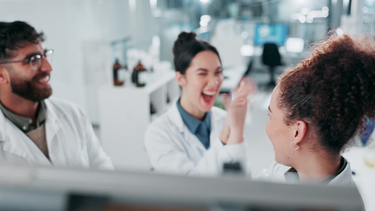 Team of Scientists Celebrating Success in the Lab