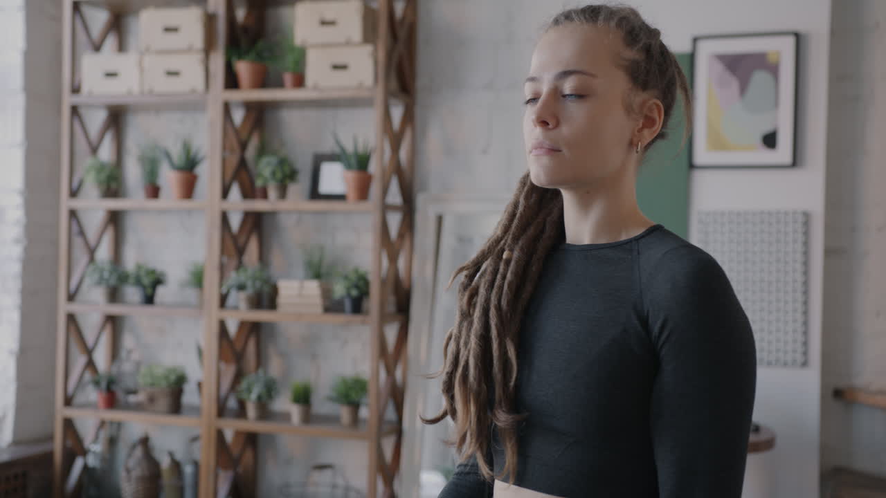 Young Woman Working Out at Home with Dumbbells