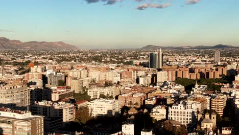 aerial shot flying over the city of murcia in spain on a summers day