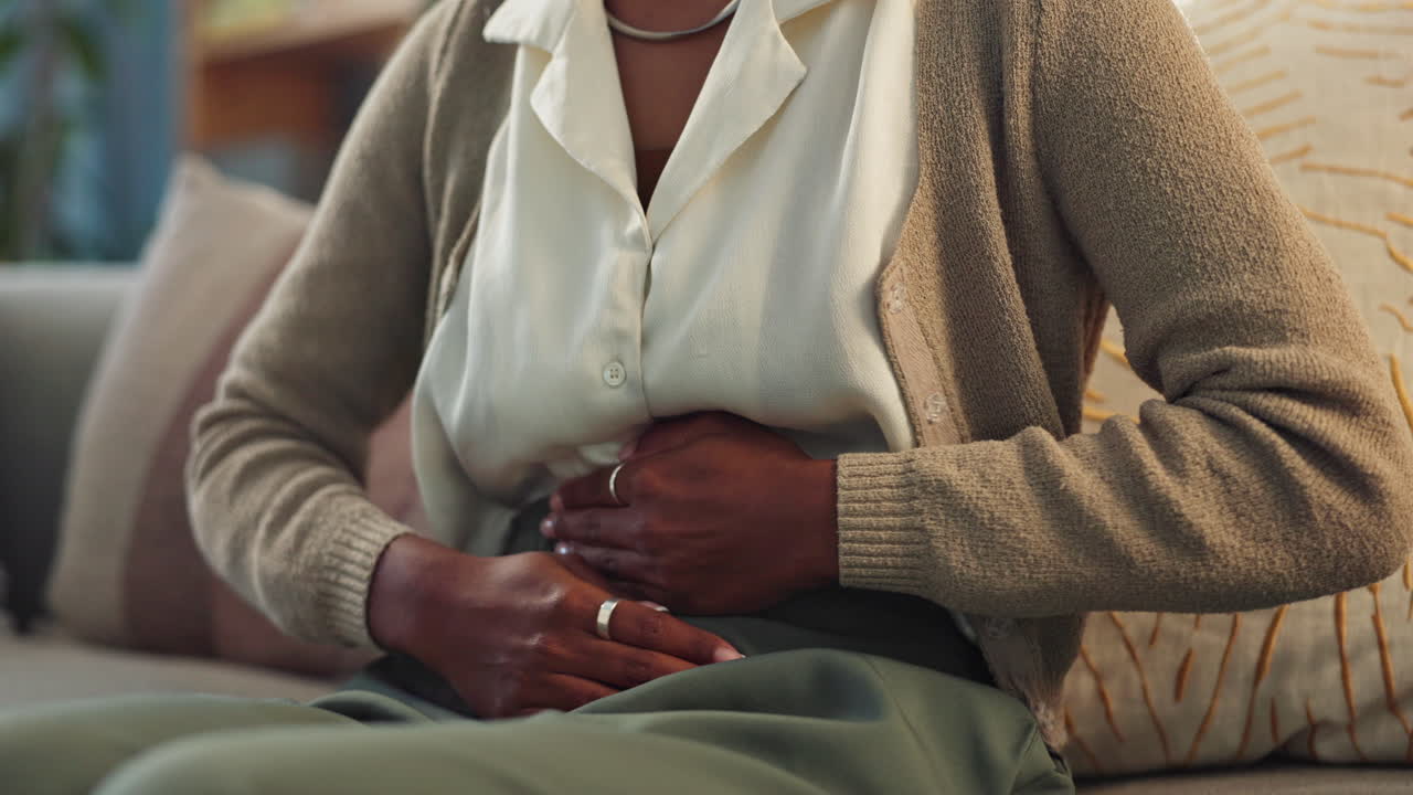 Woman experiencing stomach pain