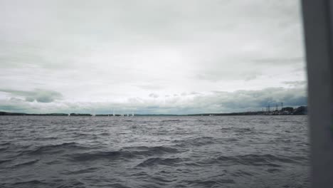 sailboats on a cloudy lake