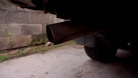 close up shot of exhaust from a car with a diesel engine emits smoke