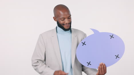 hombre negro, burbuja de habla y señalando a la pancarta