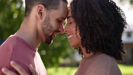 happy, love and couple with affection in a garden