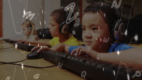 animation of multiple alphabets floating over asian boy using computer at school