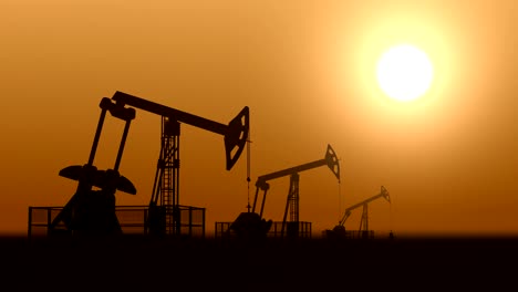las bombas de aceite en el desierto contra la puesta del sol extraen petróleo crudo. bucle sin costuras.