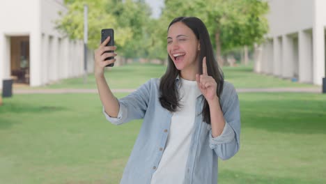 happy indian girl clicking selfies