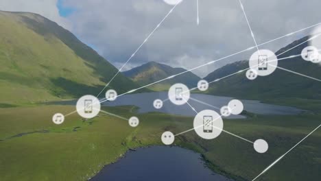 animation of icons connected with lines, aerial view of lakes, mountains against cloudy sky