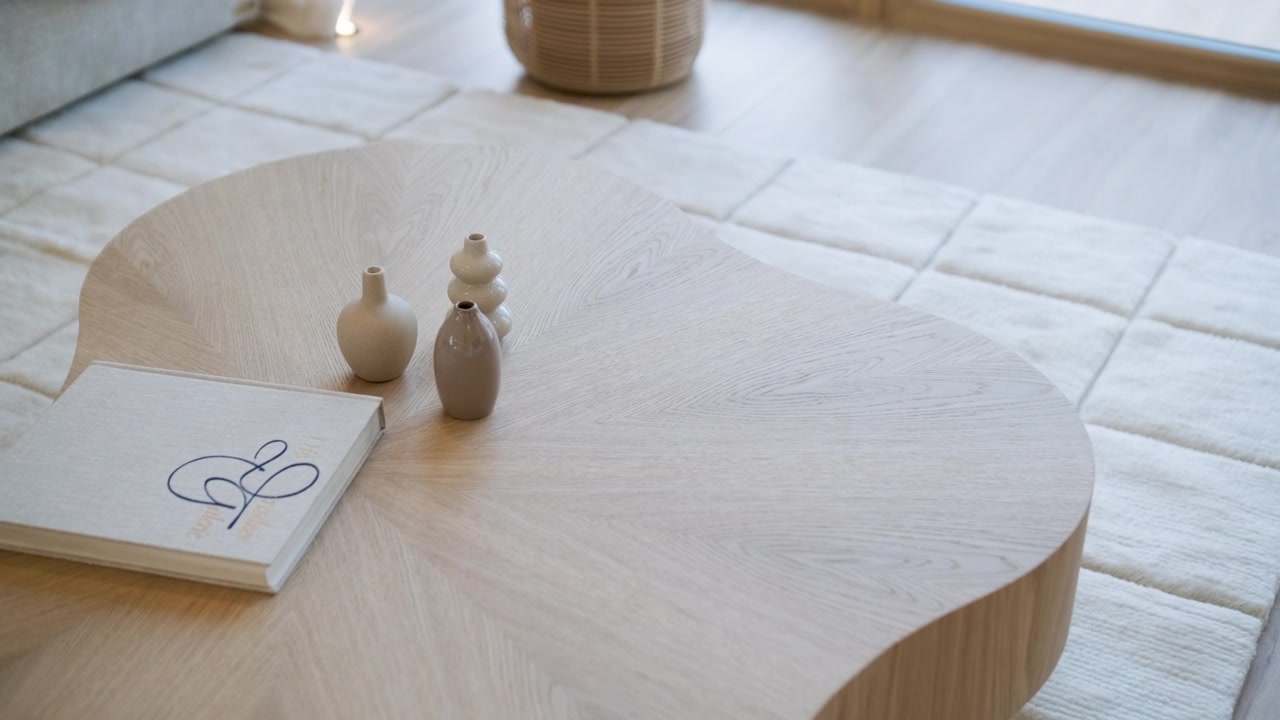 Minimalist Wooden Coffee Table with Decorative Vases and Book