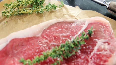 Sirloin-chop-and-ingredients-on-chopping-board