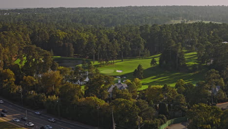 Augusta-Georgia-Aerial-v30-low-birds-eye-view,-flyover-capturing-the-landscape-of-National-Golf-Club-with-pristine-lake-environment-and-intricate-course-layout---Shot-with-Inspire-3-8k---October-2023