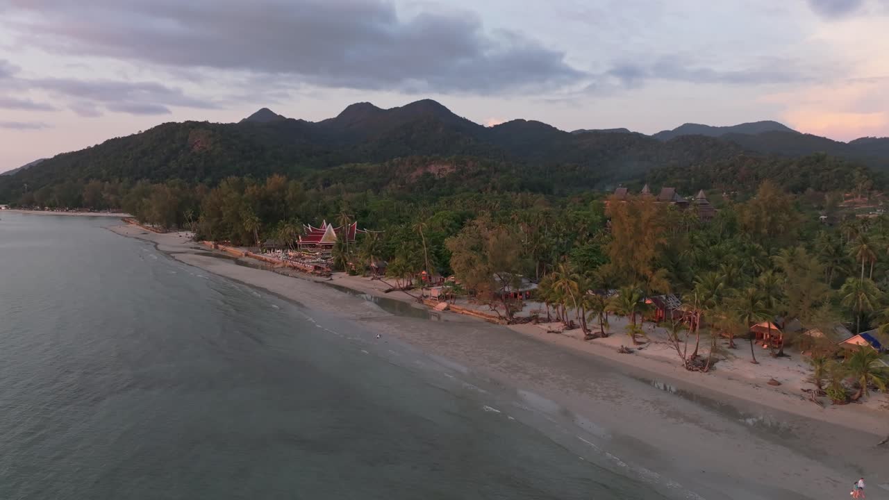 Top-down view of sunset-lit coast with visitors, Koh Chang, Thailand