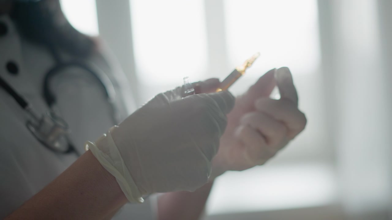 Paramedic prepares efficiently. Paramedic quickly assembles necessary supplies in tense moment. Medical responder meticulously prepares injection tools with focused calm in emergency setting