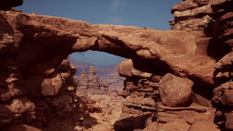 a natural arch in a red rock canyon