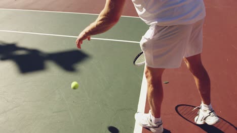 man playing tennis on a sunny day