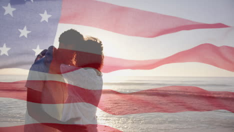 animation of american flag over diverse couple embracing on sunny beach