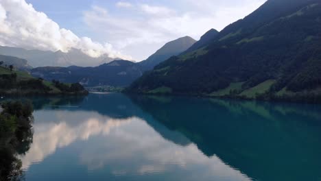 scenic aerial panorama of lungernersee lake in switzerland on summer evening