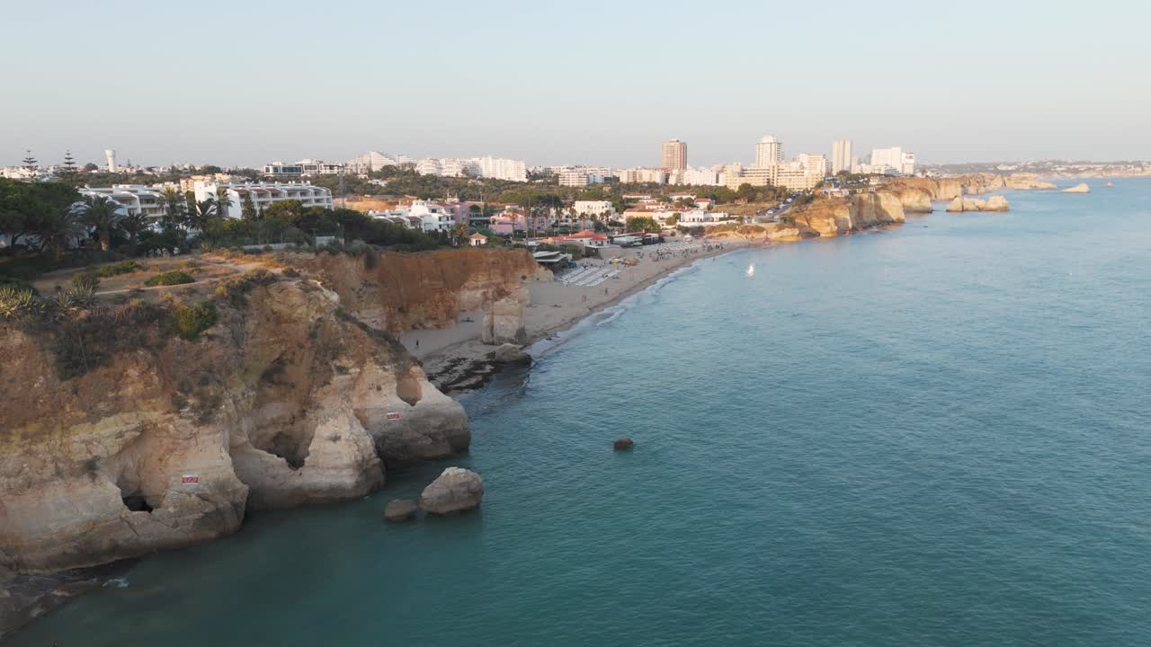 A breathtaking aerial view of Alvor cliffs, turquoise water, and scenic coastal surroundings