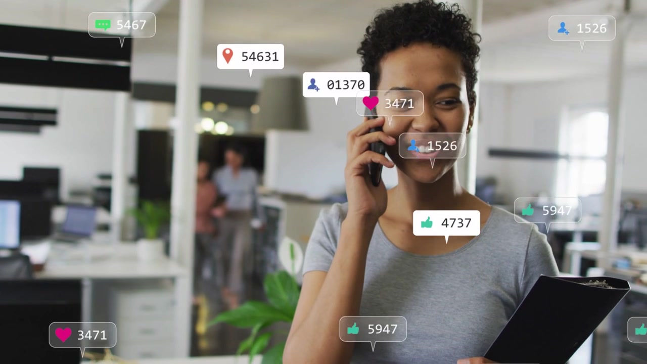Woman in office talking during phone call, social badges rising around, showing social media growth
