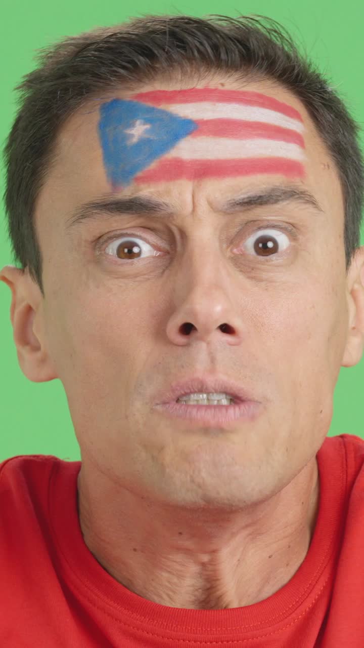 Man with puerto rican national flag upset with a referee