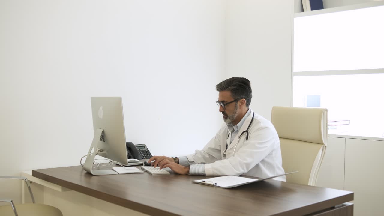 Female doctor sitting on chair at computer desk to start her work