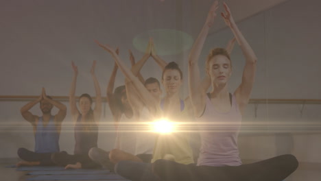 animation of glowing light over people practicing yoga