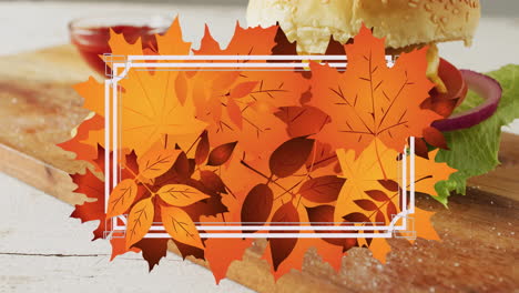 animation of frame with fall leaves over hamburger