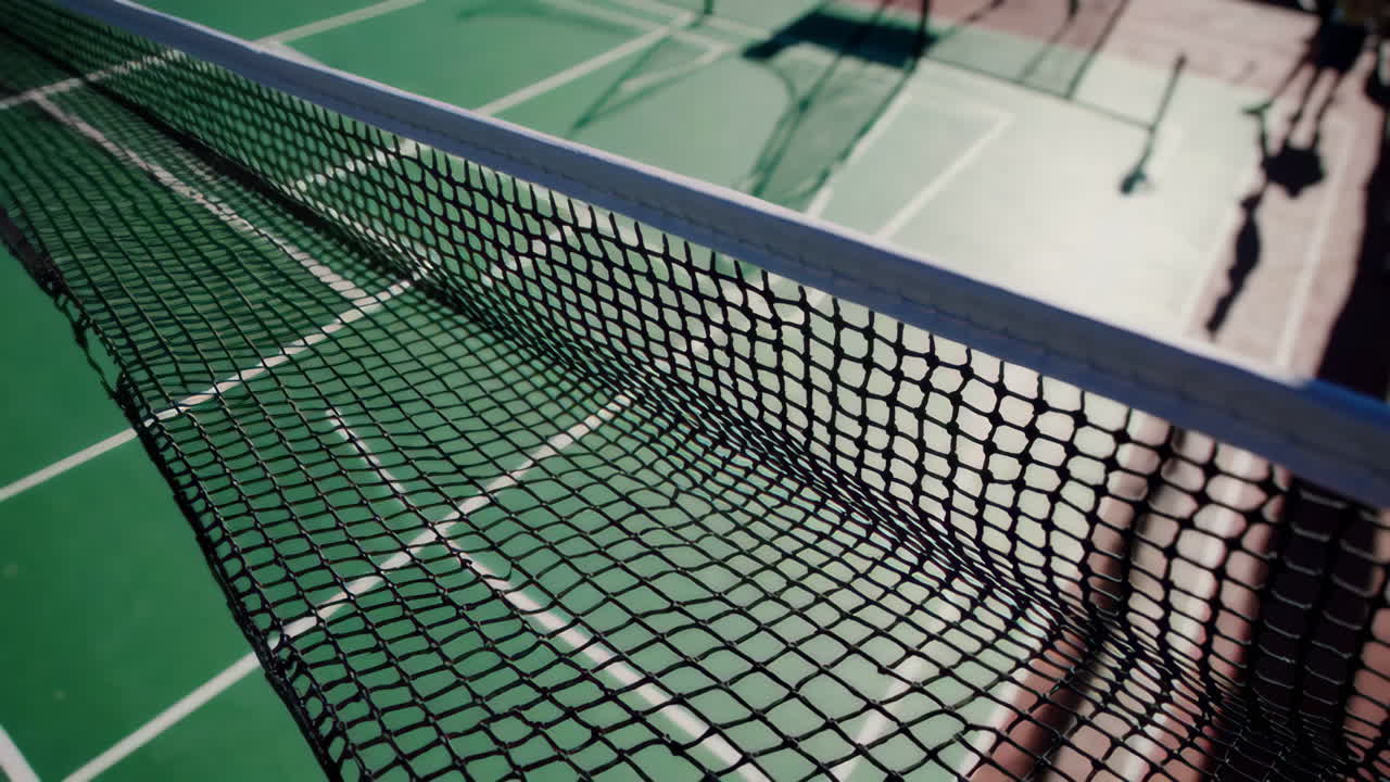 Empty outdoor badminton court with net