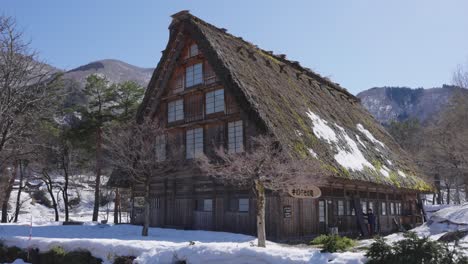 shirakawa go village in gifu japan, hatched roof establishing shot