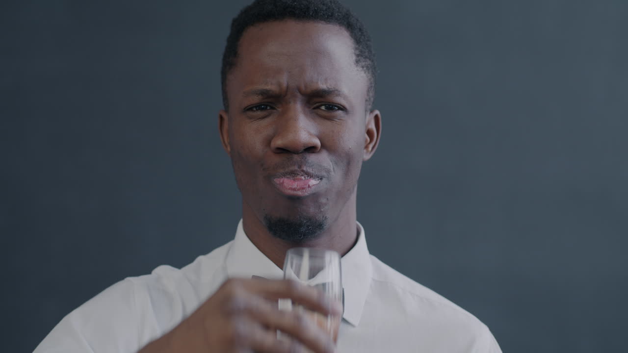 Man Celebrating with a Drink